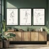 Three framed art prints featuring minimalist line drawings of yoga poses with text: 'Sun', 'Mud', and 'Hatha'.