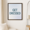 Framed print with the text 'GET DRESSED' in bold letters against a gradient background.