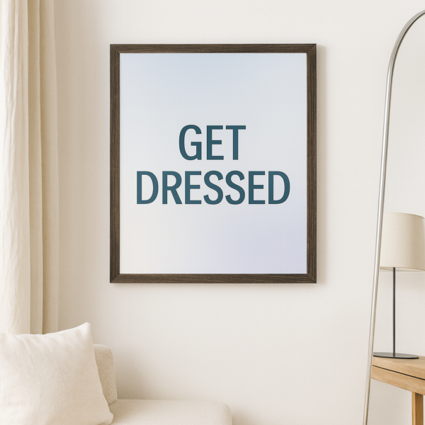 Framed print with the text 'GET DRESSED' in bold letters against a gradient background.
