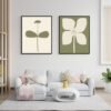 Two framed botanical prints featuring a simple flower design on the left and a larger flower illustration on the right, both in muted colors.