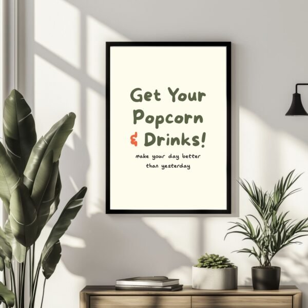 Framed wall art with the text 'Get Your Popcorn & Drinks! make your day better than yesterday' in a modern design.